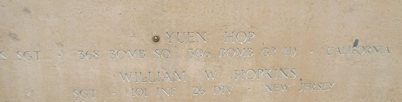 A bronze rosette is placed next to the name of Yuen Hop