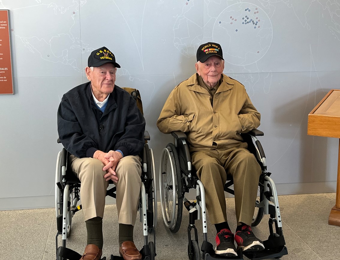 William “Magic Bill” Hunter (on the left) and Eugene “Gene” Kleindl (on the right) at Pointe du Hoc Visitor Center. Credits: ABMC. Credits: ABMC