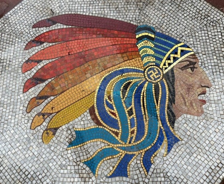 A Native American head mosaic under the arch of the Lafayette Escadrille Memorial. Credit: American Battle Monuments Commission