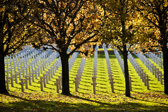 Rows of headstones in autumn at Meuse-Argonne American Cemetery.