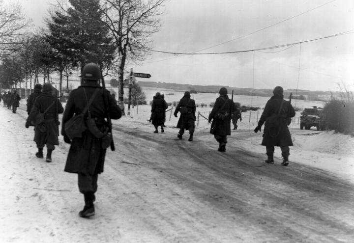 Members of the 101st Airborne move out of Bastogne. 