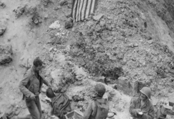 This historic image of Army Rangers at the cliffs of Pointe du Hoc shows a screenshot used in the app. 