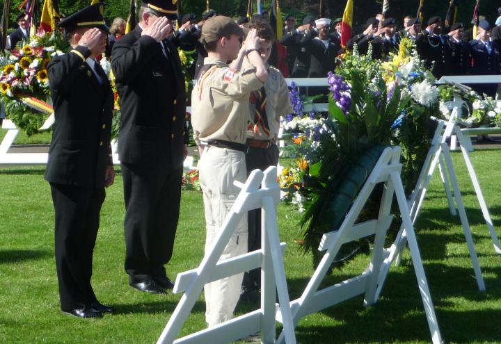 Attendees salute a wreath during the 2012 Memorial Day ceremony at Henri-Chapelle American Cemetery.