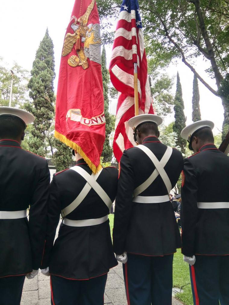 Marines stand shoulder to shoulder.