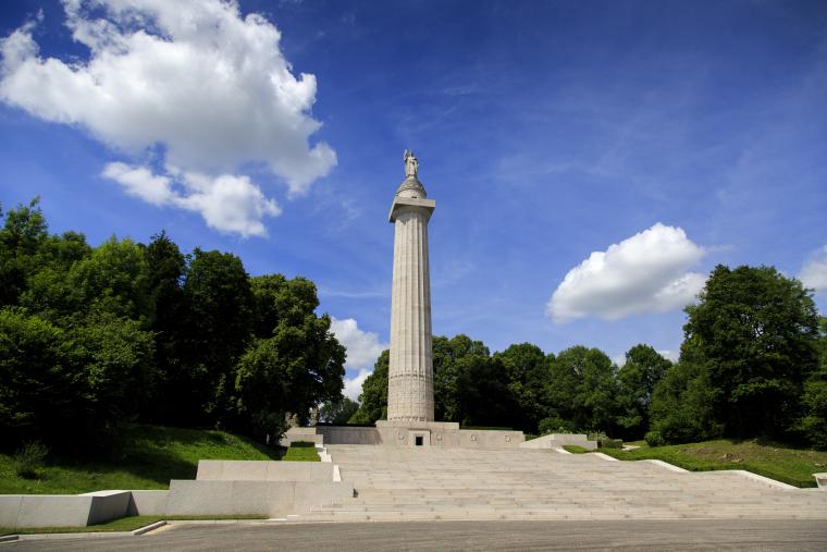 The 200 ft stone column rises high above the landscape. 