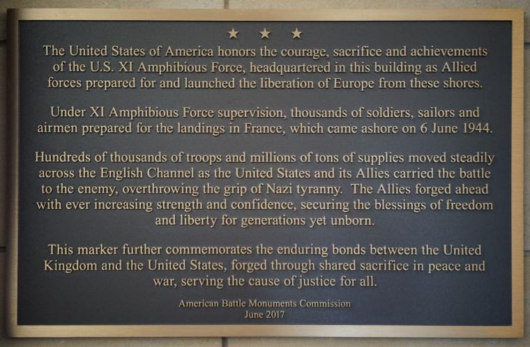Text of this plaque commemorates the headquarters for the XI Amphibious Force.