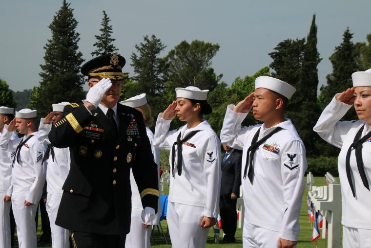 Sailors salute an Army officer during the ceremony. 