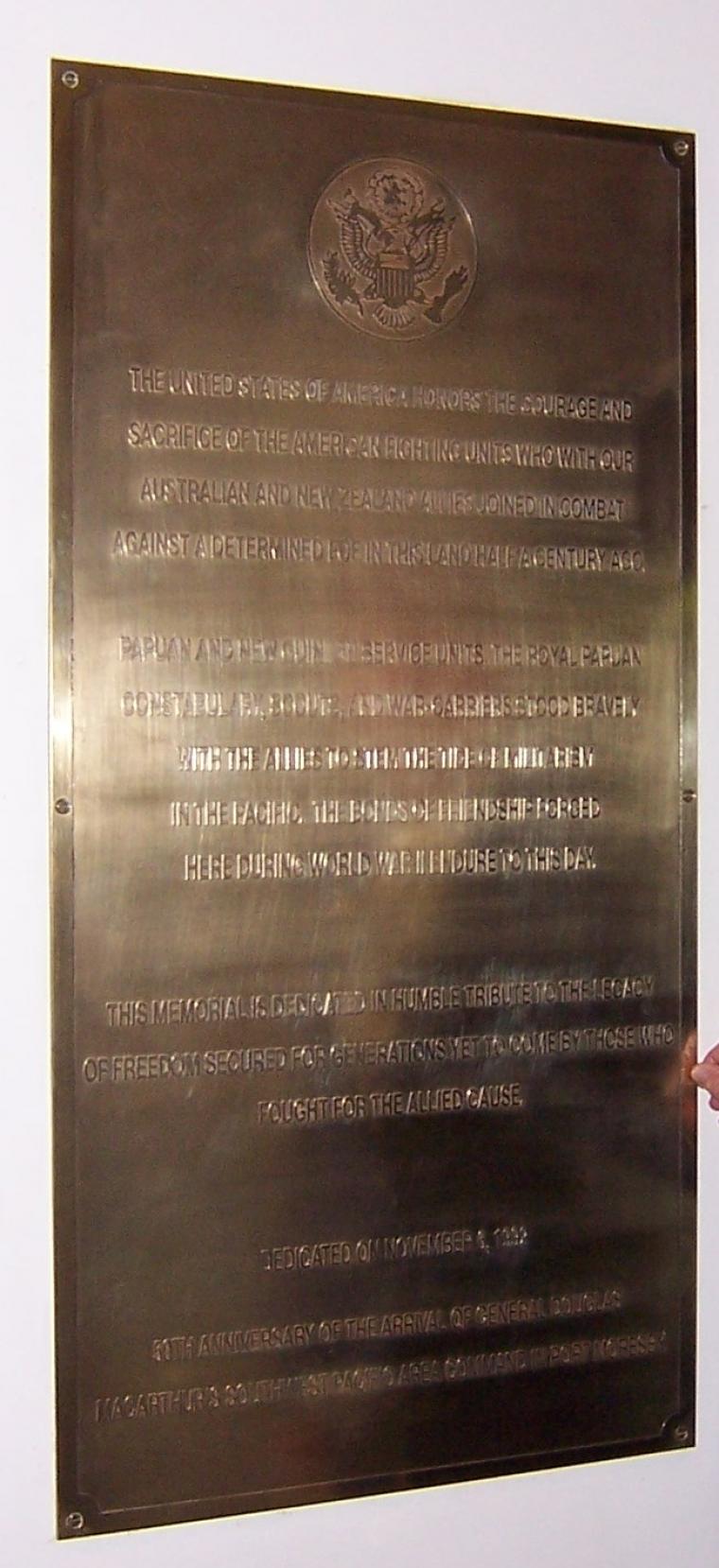 A bronze tablet serves as the Marker at Papua New Guinea.