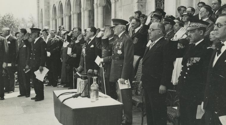 Historic photo shows Pershing saluting as he stands amidst many others.